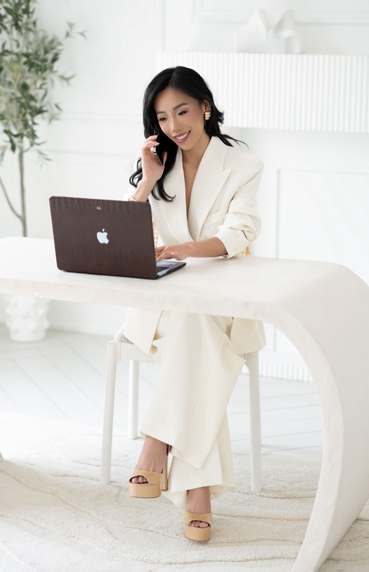 Eva on a call at her desk