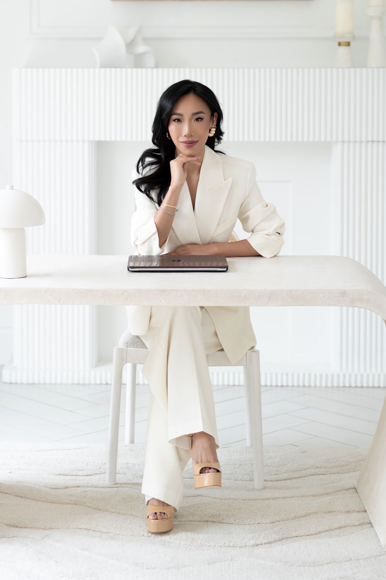 Eva seated at her desk