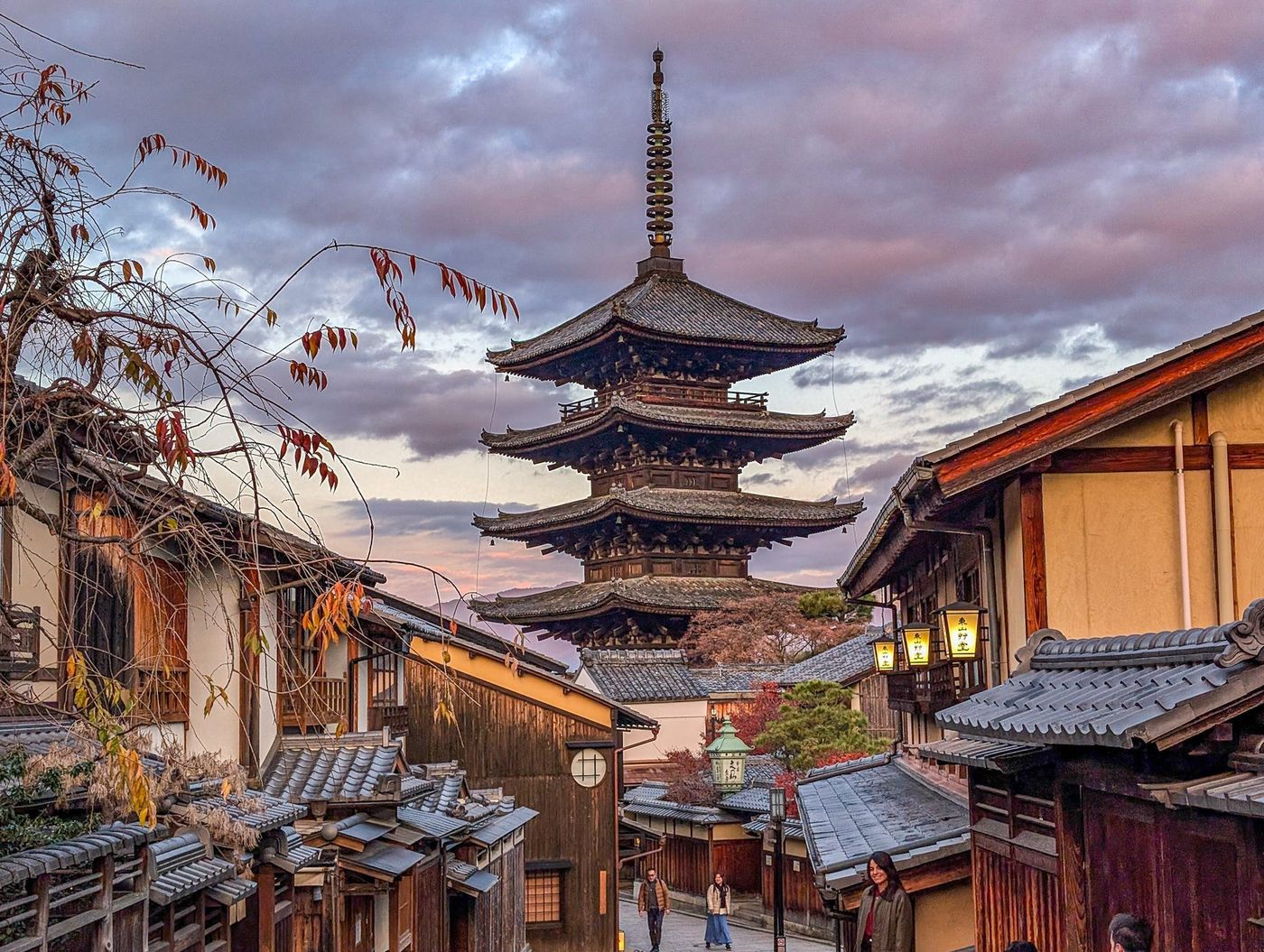 The Yasaka pagoda above a lantern-lit street in Kyoto at dusk